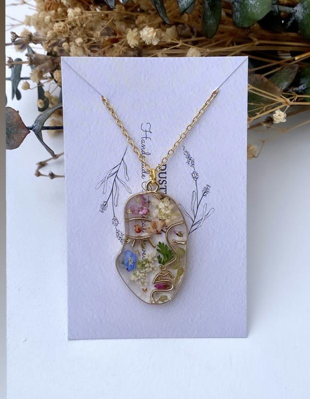 Abstract face floral pendant